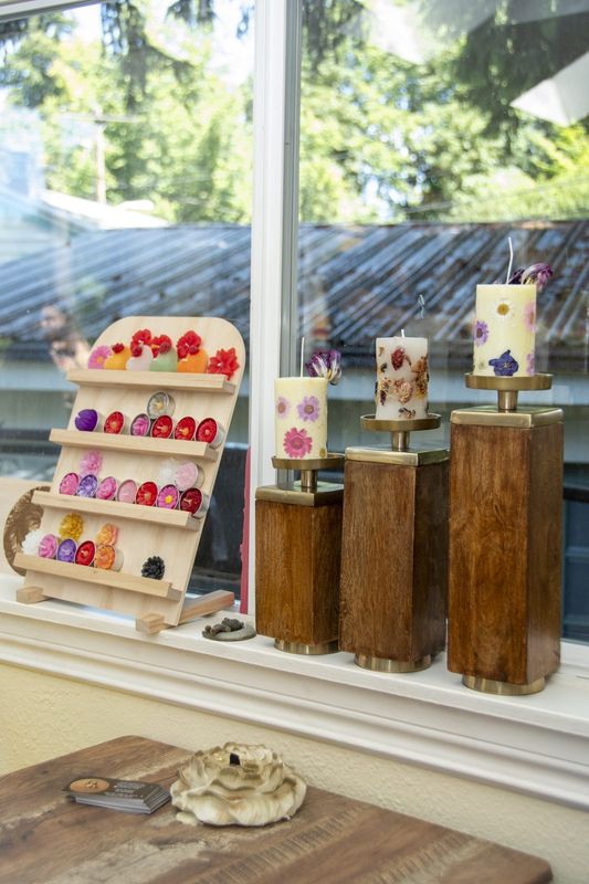 Pillar candles on wooden risers in the window